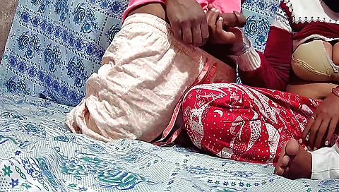 A brunette with big tits gives a blowjob and a handjob