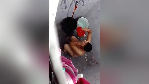 Indian bhabhi in red lingerie is having a great solo bath