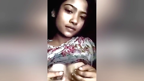 Indian solo girl shows off her big tits in her bedroom