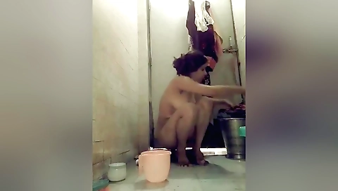 Indian hairy woman with natural tits bathed in soap