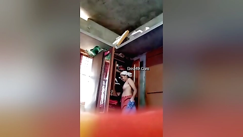 Bhabhi is naked and wearing a sexy dress for solo video