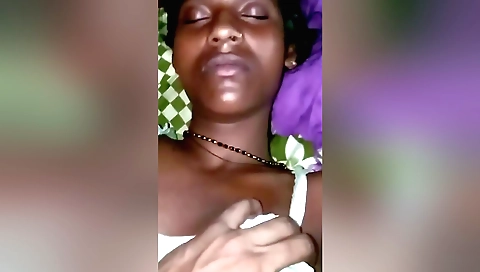 Amateur brunette plays with her pussy in the living room