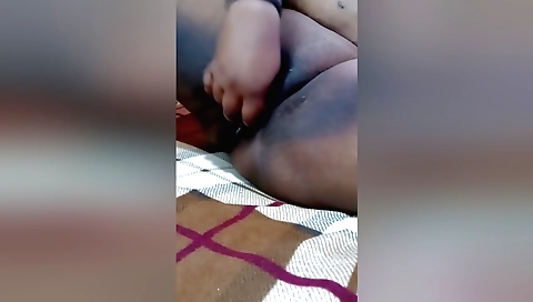 Indian wife with a cucumber toy enjoying fun with vibrator