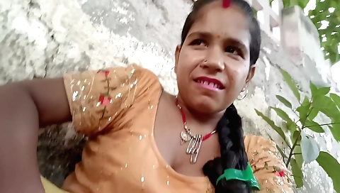 Devar bhabi is riding her bike outside on the grass