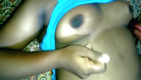 A hot milf in sexy clothing is giving a sexy blowjob